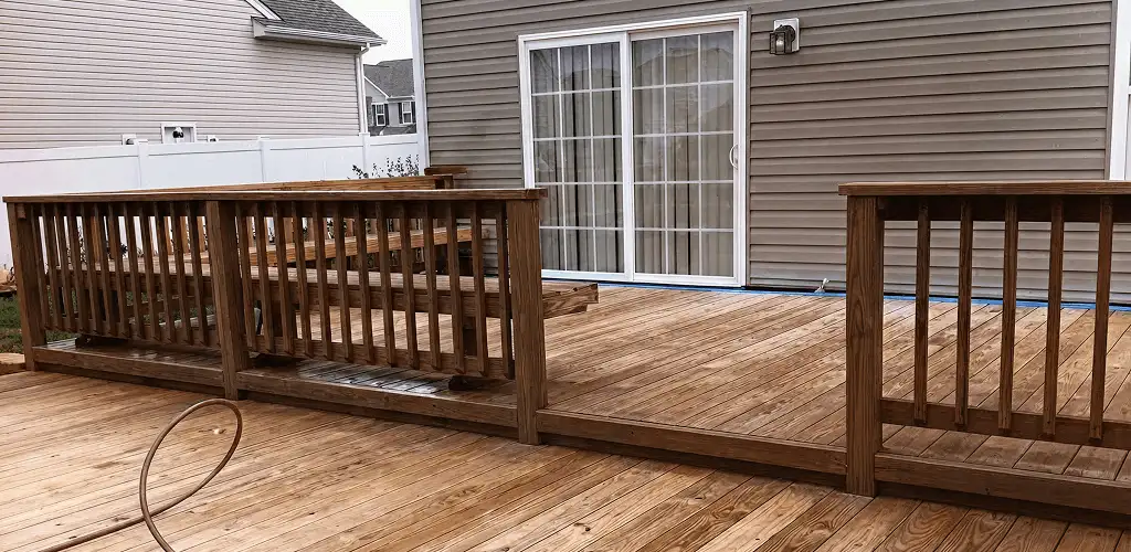 Deck sealing service protecting a backyard wood deck and railings in Charleston, SC