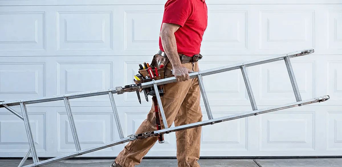 Garage door repair technician arriving with tools and ladder in Charleston, SC