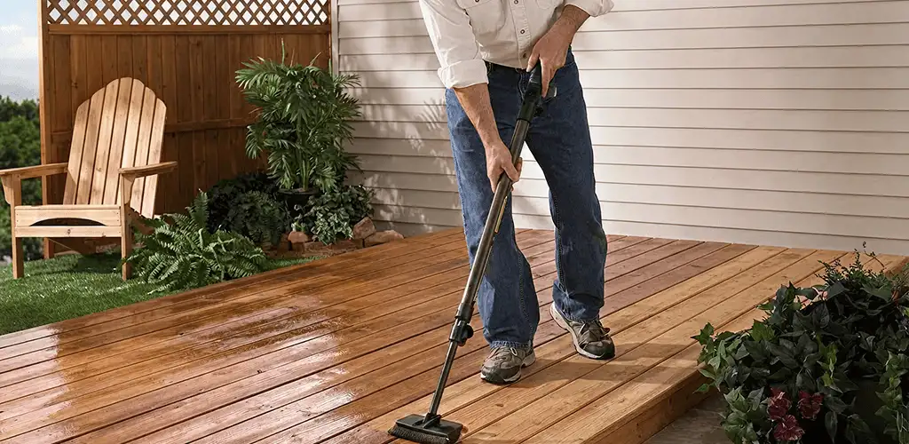 Deck staining service applying stain to a backyard wood deck in Charleston, SC